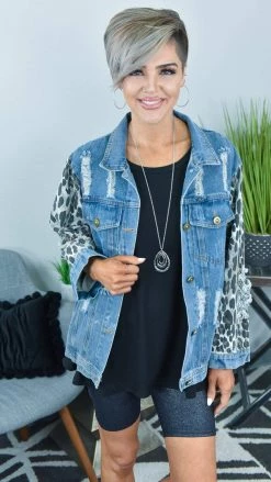 BiBi OUTERWEAR Distressed Denim Jacket With Leopard Sleeves